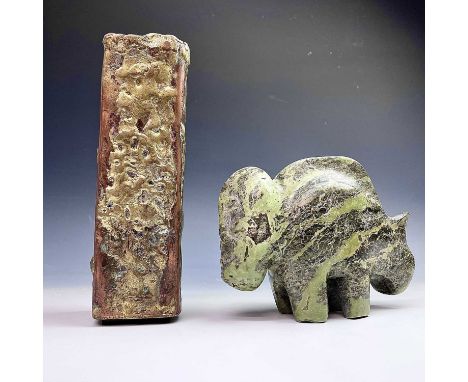 Follower of Max BarrettAn anthropomorphic green marble beast with tribal style head, length 17cm, together with a braised cop