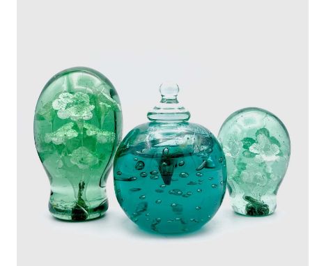 Two Victorian glass dumps, both with potted flower inclusions, heights 15cm and 11cm, together with an inkwell paperweight wi