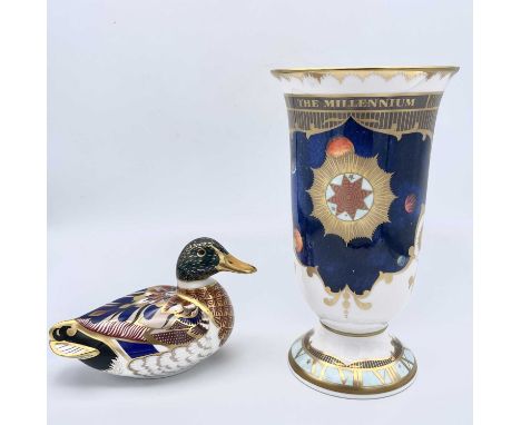 A Royal Crown Derby mallard paperweight, with gilt stopper, length 14cm, together with a Royal Worcester millennium vase (2).