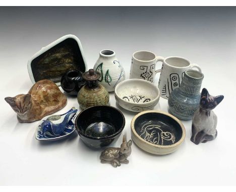 Two studio pottery cats, signed Peyman, four studio pots by Maggie Frazer, a Copenhagen porcelain bird form whistle and a sim
