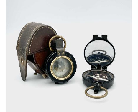 A WWI lacquered brass marching compass by J.H Steward London with leather case, and a German issue marching compass stamped '