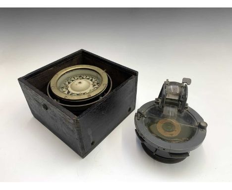 A compass marked Azimuth circle No4 Ref No 6A/890 possibly for the Air Ministry, together with a brass compass in a brass gim