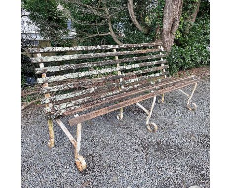 A wrought iron and slatted bench originally from Lord's cricket ground, length 184cm.