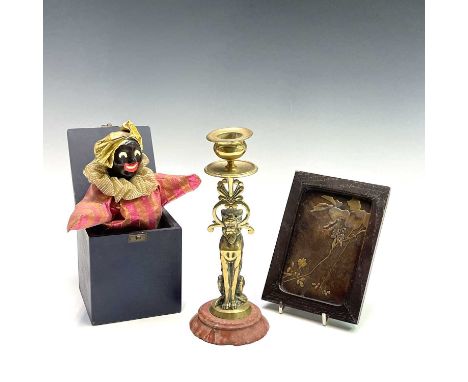 A 19th century cast brass candlestick, the nozzle supported by a panther, height 20.5cm, together with a Japanese small lacqu