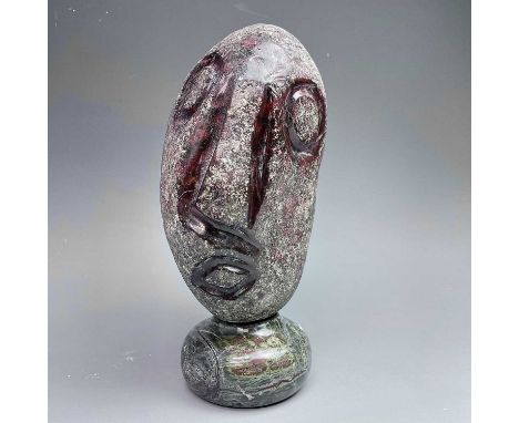 Follower of Max BarrettA carved serpentine stylised head, from a pebble, on socle base, height 23cm.The Personal Collection o