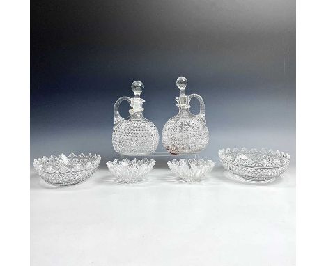 A pair of Victorian cut glass decanters and stoppers, with side handles, height 23cm, together with a pair of oval 19th cut g