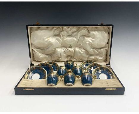 A Royal Worcester cased porcelain coffee set for six, retailed by Mappin and Webb, date code for 1926, the powder blue ground