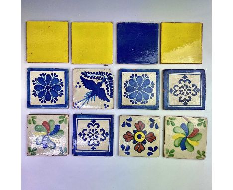 20th Century Mexican ceramic tiles decorated in polychrome enamels with various designs, 10.2cm x 10.2cm. (12).