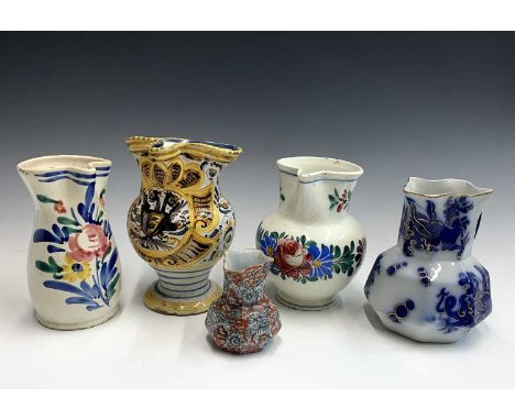 A Maiolica jug, probably Spanish, 19th century, height 22.5cm, together with two other Continental jugs and two Mason's jugs 
