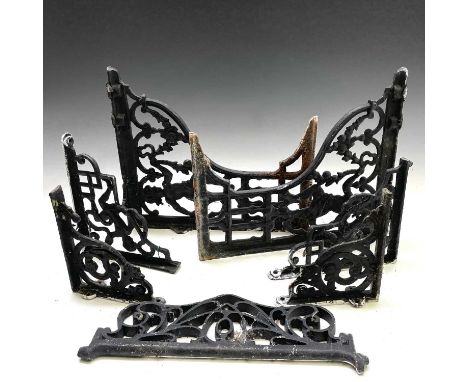 A pair of Victorian cast iron bracket supports, each with a child supporting garlands, Rd No 299967, height 41cm, depth 36cm,