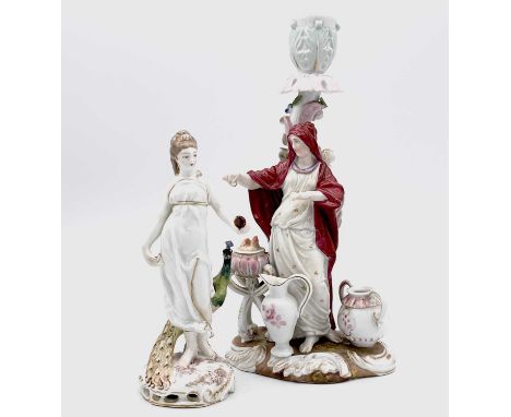 A German porcelain figural candle holder, modelled as a woman beside a brazier, height 21.5cm, together with a German Art Nou