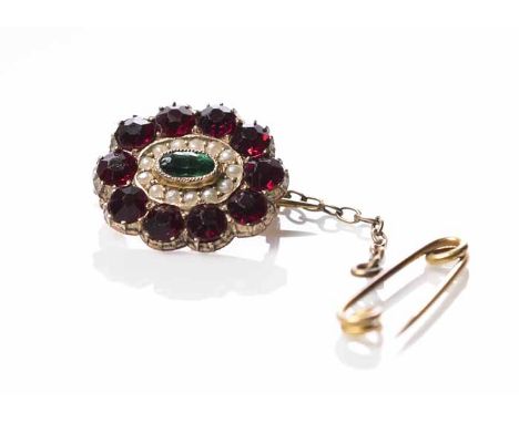 EARLY TWENTIETH CENTURY PEARL AND PASTE SET BROOCH
of oval form, set centrally with a green gem stone, surrounded by a row of