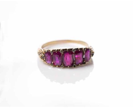 VICTORIAN RUBY FIVE STONE RING
set with graduated possibly synthetic rubies, in scrolling boat shaped setting, unmarked, size