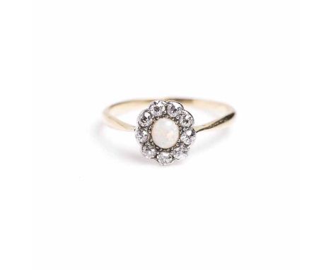 OPAL AND DIAMOND CLUSTER RING
with a central oval cabochon opal surrounded by old cut diamonds, unmarked, size P