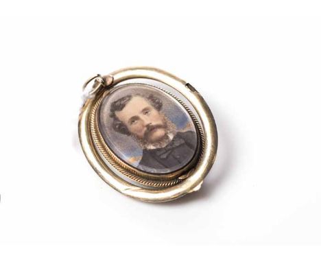 VICTORIAN PORTRAIT MOURNING BROOCH
of oval form, set with the portrait of a gentleman, the border with black enamel, with gla