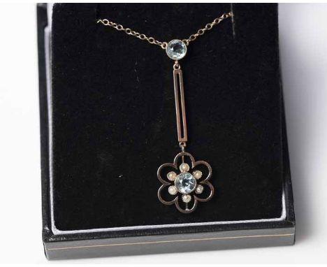 EDWARDIAN SEED PEARL AND AQUAMARINE PENDANT ON CHAIN 
of floral form, with a central round aquamarine surrounded by seed pear