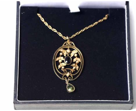 AMETHYST, PEARL AND PERIDOT SET PENDANT
in colours of Suffragette movement, of pierced oval form, with a central oval amethys