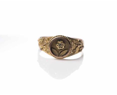 NINE CARAT GOLD MOURNING RING
of floral design, set with a small diamond, inscribed on the inside 'In Love Abide, Til Death D