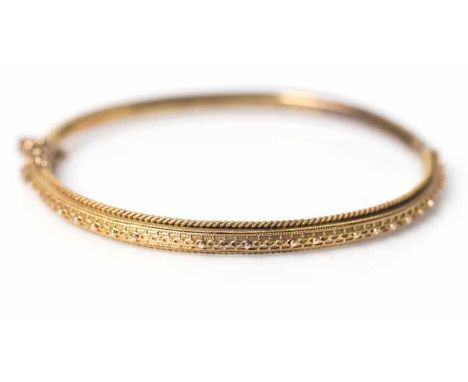 VICTORIAN BANGLE
with beaded decoration and twist design borders, unmarked, 7.7g