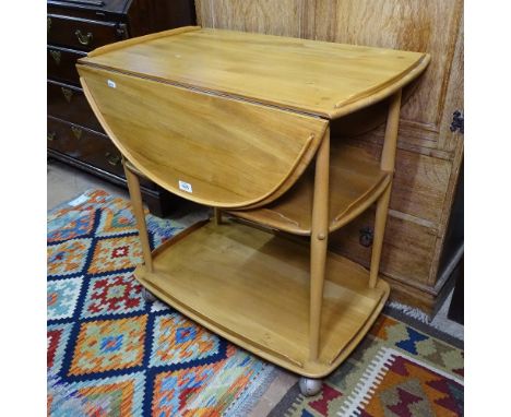 An Ercol and beech 3-tier drop leaf tea trolley, W73cm, H76cm, D47cm 