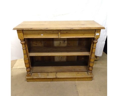 An Antique pine side cabinet, with 2 frieze drawers, open shelf below, and turned pilasters, W116cm, H94cm, D43cm 