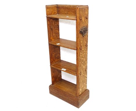A small Arts and Crafts oak open bookcase of narrow size, W34cm, H80cm, D17cm, shelf depth 15.5cm 