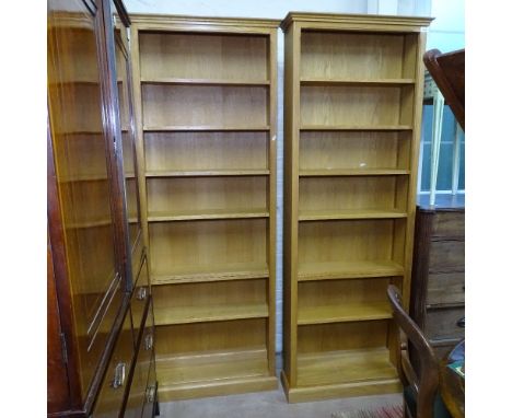 A graduated pair of modern light oak open bookcases with adjustable shelves, W71cm, H198cm, D24cm, shelf depth 18cm, other bo