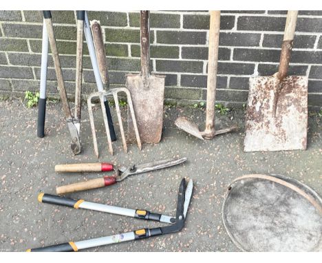 Garden tools and a griddle. 