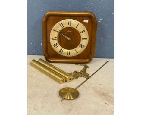A vintage Hermle wag on the wall clock. 