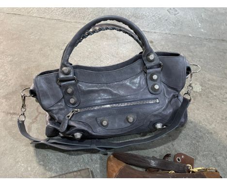 A collection of designer style clothing accessories. Sunglasses, handbag, scarf, purse etc 