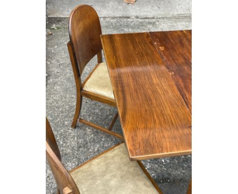 A vintage draw leaf table and 4 chairs. 