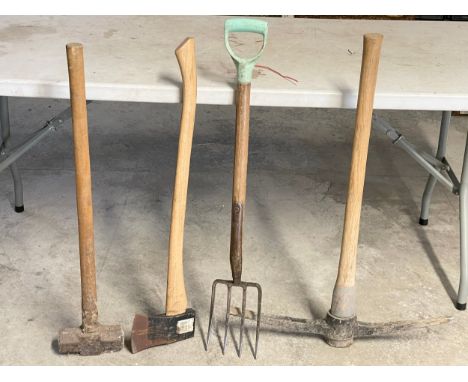 4 garden tools. Sledgehammer, axe, pickaxe  and a garden fork. 