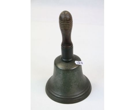 Vintage hand Bell with turned Wooden handle, with marks to Bell and an Iron clapper, stands approx 23.5cm