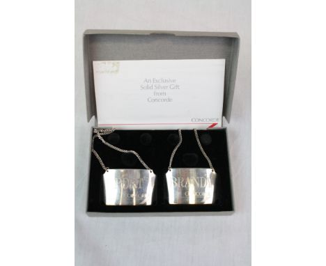 Boxed pair of Hallmarked Silver "Concorde" Decanter labels, one marked "Port" the other "Brandy"