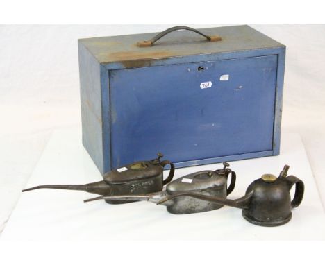 Vintage metal tool box with drawers and three vintage oil cans 