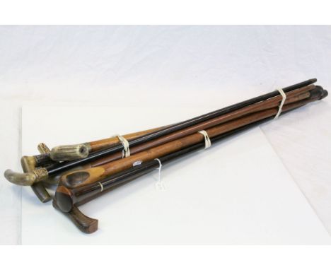 Five antique walking sticks with horn and antler handles, together with two vintage walking canes with a walking stick 