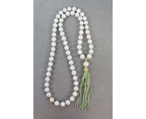 Impressive long row of cultured pearls set with peridot and ruby 