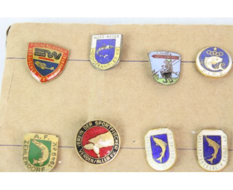 35 Vintage enameled international fishing badges