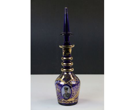 19th Century Bristol Blue glass Decanter with Bohemian style Gilt decoration &amp; oval panels depicting a Military style fig