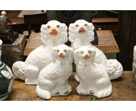 Two pairs of 19th century Staffordshire ceramic Spaniels, tallest pair approx 32cm tall