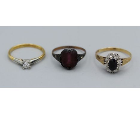 A trio of dress rings. A sapphire and illusion set diamond 9ct gold ring, size N, weight 1.7gm. A diamond solitaire in 18ct g