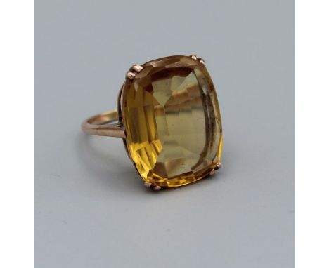 An attractive Citrine set cocktail ring set in yellow metal which tests as 9ct gold, size R, gross weight approx 7.8gm, in a 