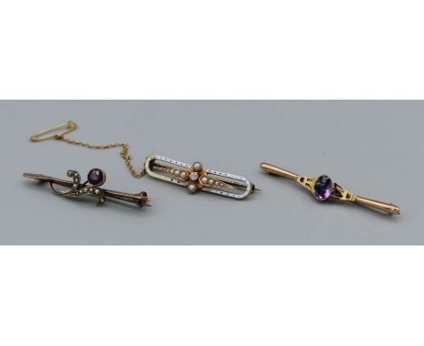 A trio of late Victorian/ Edwardian bar brooches comprising an enamel seed pearl set with an old European cut diamond (approx