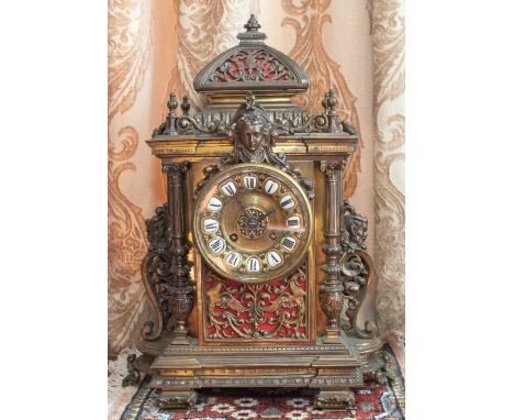 An English brass mantel clock with French movement by J Edmonds, 668 Gt Baker Street, London, engraved on the dial. The front