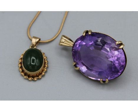 A pair of pendants, one an amethyst measuring 28mm x 21mm in a yellow metal mount assessed as gold, gross weight approx 11.6g