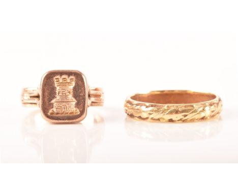 A yellow metal wedding ring with engraved pattern, size N, together with a rose metal signet ring featuring a recessed intagl