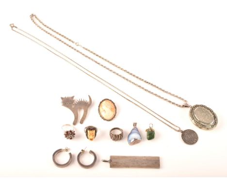 A collection of silver jewellery, including a cameo and marcasite b rooch, two gem-set pendants, a silver locket with rope ch
