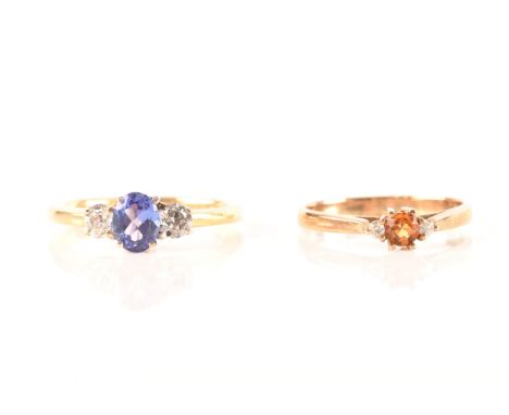 An 18ct yellow gold sapphire and diamond three stone ring, set to centre with a oval cut sapphire with an approximate weight 