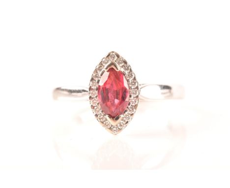 A 18ct white gold ruby and diamond ring, set to centre with a marquise shape ruby with an approximate weight of 0.60 carats, 