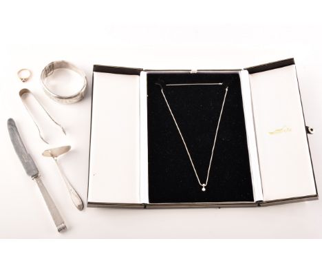 An 18ct white gold diamond necklace, the pendant set with a round brilliant cut diamond with an approximate weight of 0.15 ca